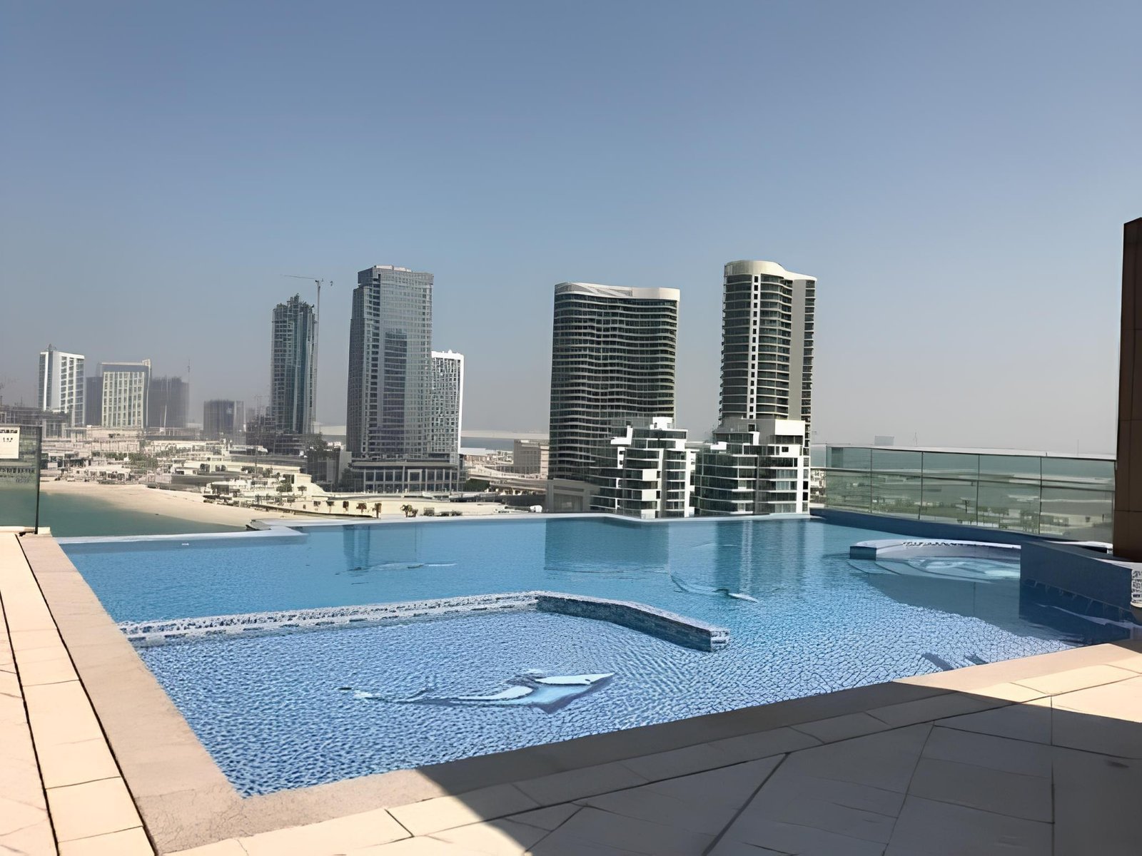 Reem Diamond rooftop infinity pool overlooking Al Reem Island, Abu Dhabi skyline